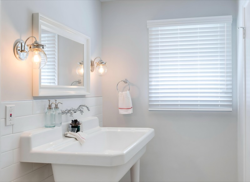 Faux wood blinds filtering soft daylight