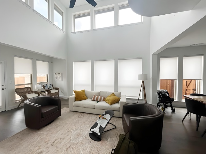 Cordless roller shades in an Austin family room