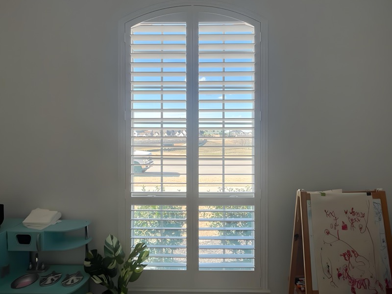 Custom shutters on a bay window