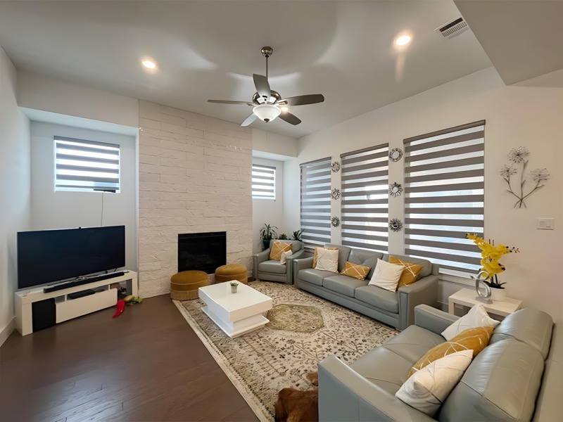 Zebra blinds providing adjustable light control